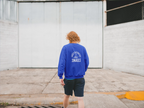 Royal blue sweatshirt with “SNails” text graphic on the back.