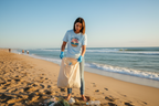 Light blue T-shirt with round Save Our Seas ocean sunset graphic