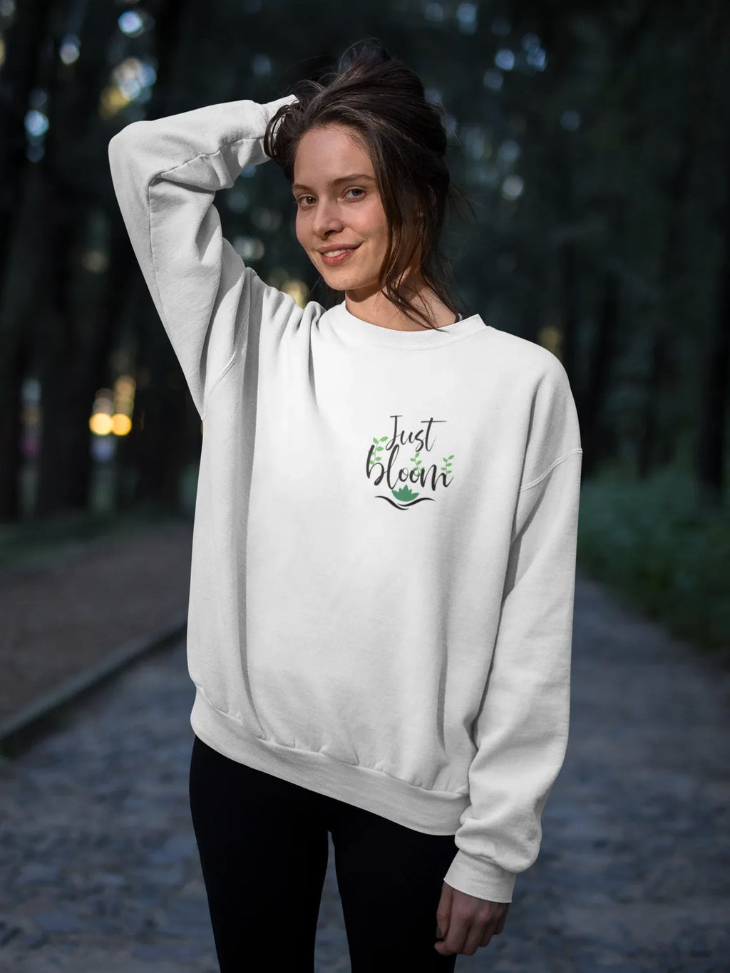 White crewneck sweatshirt with “Just Bloom” floral logo, long sleeves