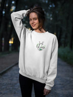 White crewneck sweatshirt with “Just Bloom” floral logo, long sleeves