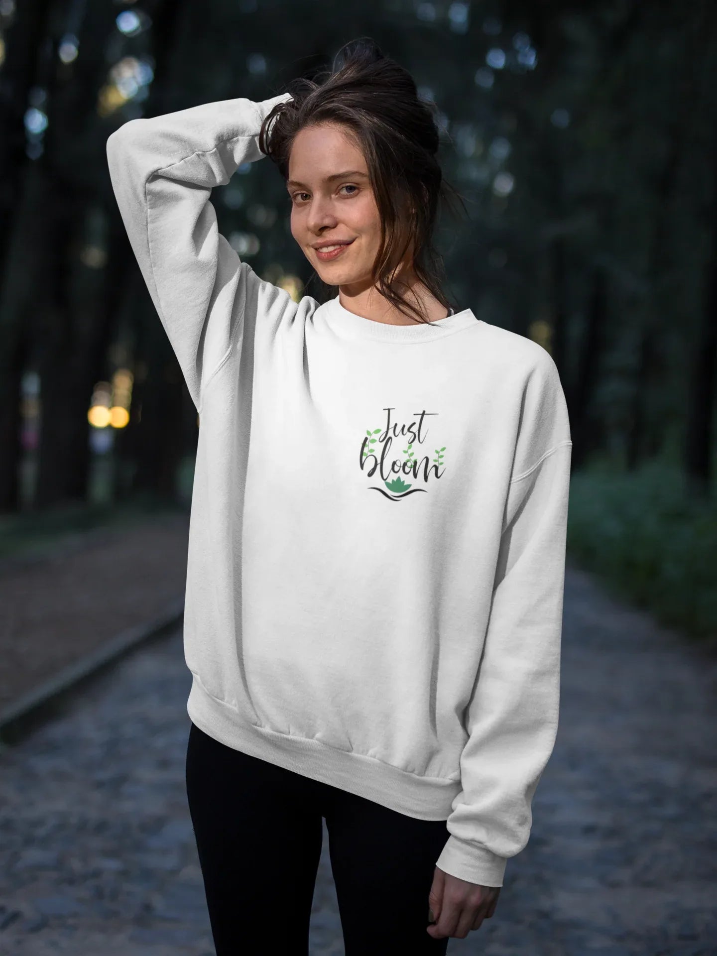 White crewneck sweatshirt with “Just Bloom” floral logo, long sleeves