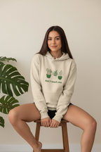 Beige sand hoodie with cactus graphic and “don’t touch me.” text on the front
