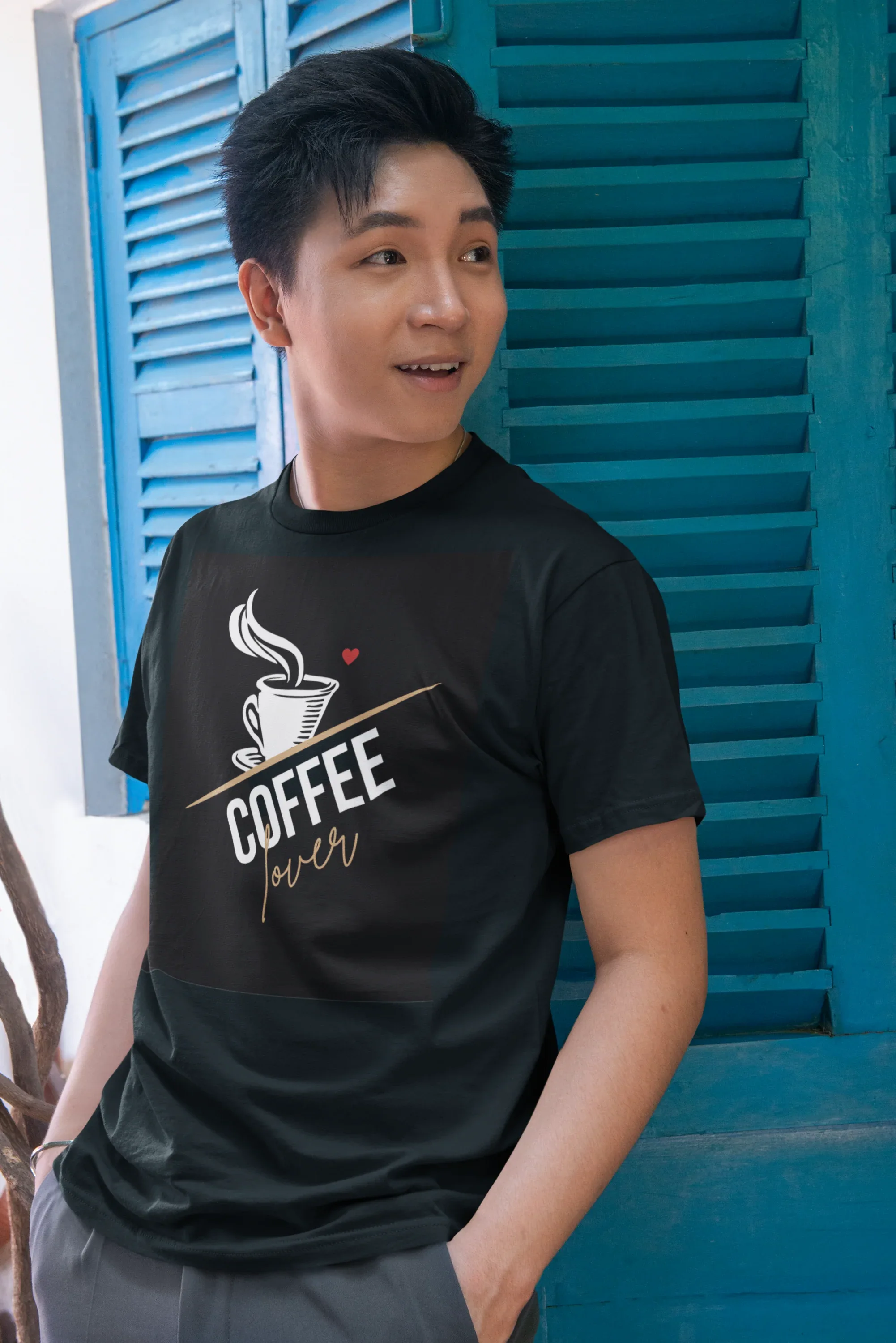 Black unisex heavy cotton T-shirt with coffee cup graphic and gold script on chest