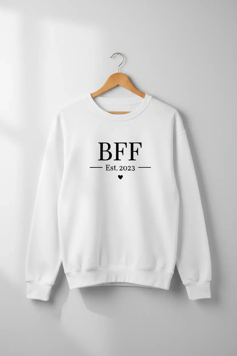 White personalised sweatshirt on hanger with front text "BFF" and Est.2023