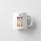 White ceramic mug with stacked BRF lettering and small heart print