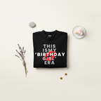 Black pullover hoodie with front graphic text "THIS IS MY BIRTHDAY GIRL ERA"