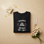 Black sweatshirt with 'Happy Birthday' cake graphic and custom name text