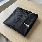 Black lightweight hooded windbreaker jacket with full front zipper and Alley logo