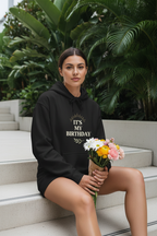 Black hooded sweatshirt with 'It's My Birthday' chest graphic and kangaroo pocket