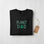 Black crewneck sweatshirt with “PLANT DED” plant graphic and brown tag