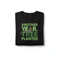 Black crewneck sweatshirt with green 'Another Year, Another Tree Planted' graphic