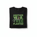 Black crewneck sweatshirt with green 'Another Year, Another Tree Planted' graphic