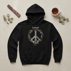 Black unisex hoodie with 'Good Vibes' wreath peace graphic and front pocket