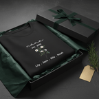 Black floral mama T-shirt in gift box with 'mama est. 2010' and recipient names