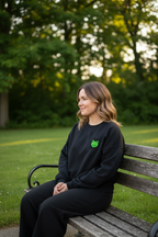Black embroidered frog sweatshirt with crew neck and small chest square patch.