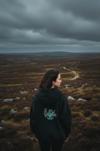 Dark hoodie with “Just breathe” slogan and hand heart graphic on back