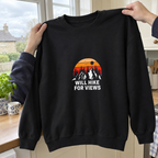 Black sweatshirt held up in natural window light