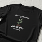Black motivational t-shirt with green plant and “progress EST. PATIENCE” slogan print