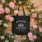Black tote against rose covered wall