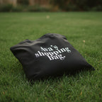Black cotton tote bag with custom text reading “Ava’s shopping bag”.