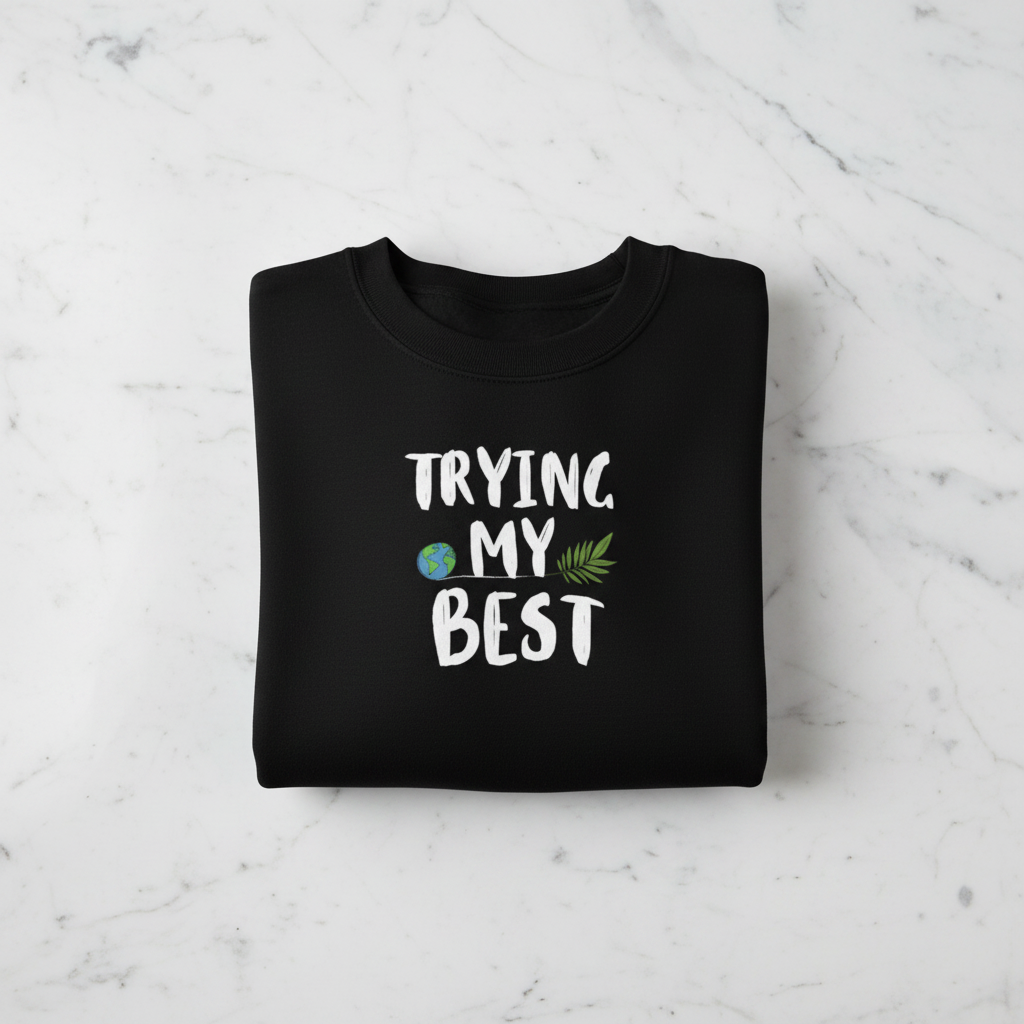 Black sweatshirt with 'TRYING MY BEST' quote and globe-and-leaves graphic