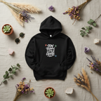 Black pullover hoodie with hood and front pocket, star “Stay Trippy Little Hippie” graphic