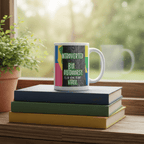 White mug with colorful nature quote on stacked books