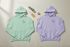Mint green unisex yoga hoodie with chest logo, pullover hood, and drawstring