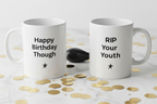 Pair of white coffee mugs with printed text "Happy Birthday Though" and "RIP Your Youth".