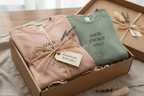 Pink and sage T-shirts with crew neck and “GOOD ENERGY ONLY” graphic