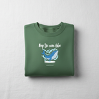 Green sweatshirt with 'Keep the ocean blue' whale graphic, crewneck long sleeves