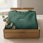 Bottle green crewneck sweatshirt with 'planet over profit' text graphic