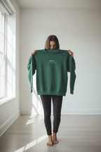 Bottle green crewneck sweatshirt with long sleeves and 'planet over profit' text