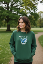 Green crewneck sweatshirt with blue whale graphic, long sleeves, and 'Keep the ocean blue'