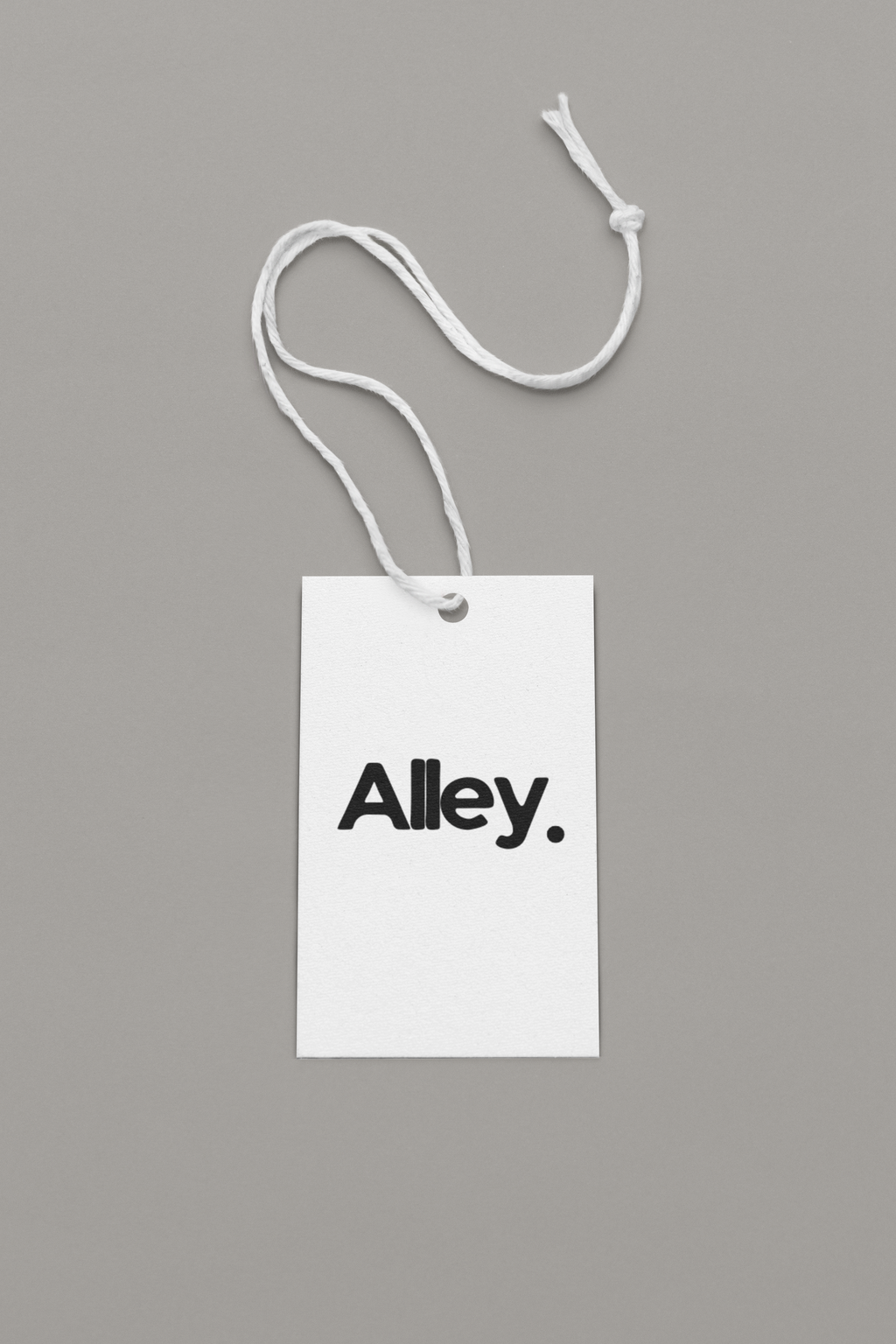 T-shirt hang tag with string and text: “Alley.”