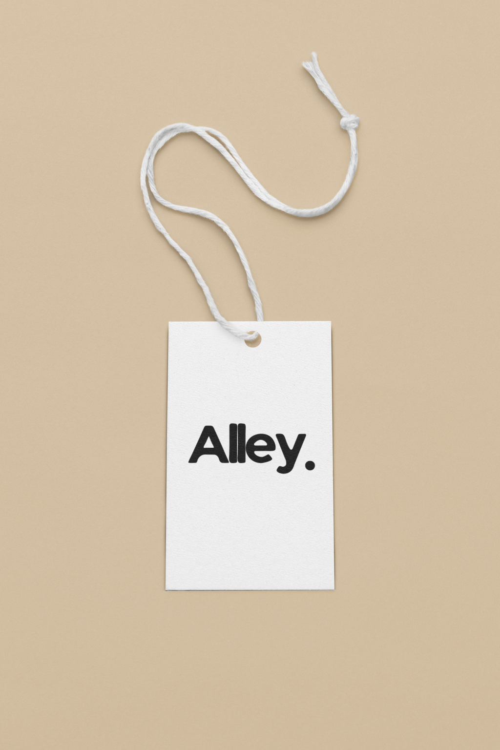 White clothing tag with "Alley." in black text