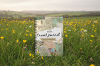 British countryside mockup of the Rosie travel journal in a meadow