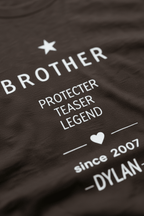 Close-up personalized dark Brother T-shirt with 'Protector Teaser Legend' and DYLAN since 2007