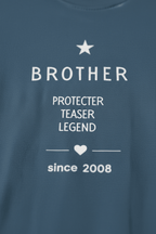 Close-up of personalized blue Brother T-shirt text: 'Protector Teaser Legend' since 2008
