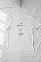 White T-shirt with light gray "BROTHER" print and personalized name CALLUM