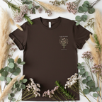 Dark brown crew-neck t-shirt with centered botanical floral bouquet and 'In my own season' text
