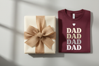 Maroon t-shirt with stacked DAD text graphic and heart
