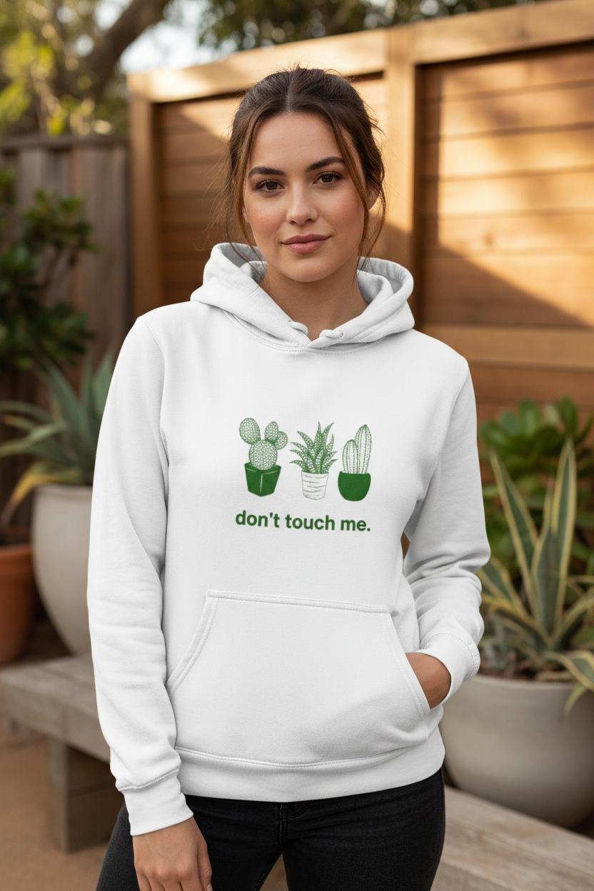 White hoodie with green cactus print and kangaroo pocket; drawstring hood