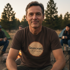 Dark chocolate crewneck T-shirt with tree-ring “Seasoned, Not Old” logo