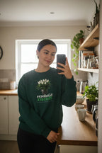 Green crewneck sweatshirt with tree graphic and 'Kindness Matters' print on chest