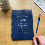 A5 hiking notebook with blue cover, spiral binding, footprints and mountain lettering