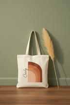 White cotton tote bag with terracotta arch graphic, front view, long handles
