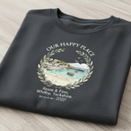 Dark gray T-shirt with scenic landscape wreath graphic and “Rosie & Finn” since 2020