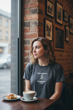 Dark gray motivational t-shirt with green plant and “progress EST. PATIENCE” slogan print