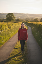 Maroon crewneck sweatshirt with long sleeves and small chest quote print
